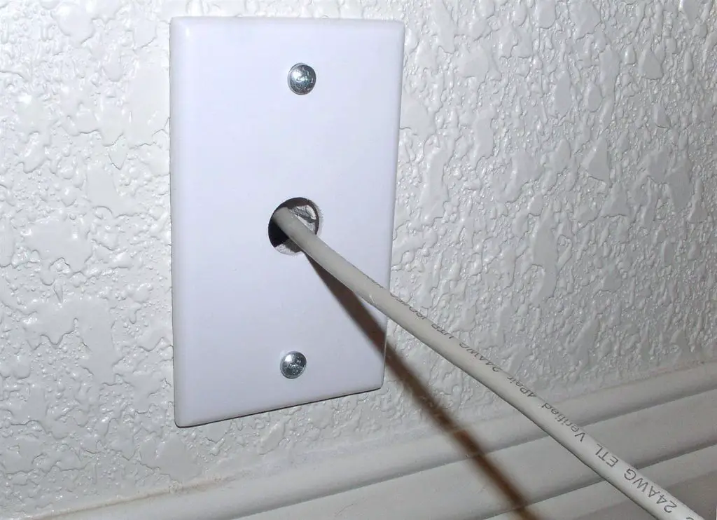 Install coaxial cables along the wall